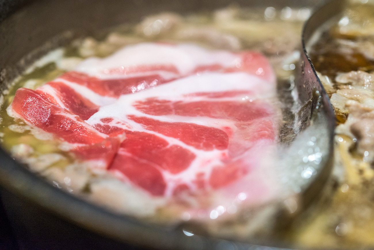 Shabu-Shabu beef thinly sliced meat in a cooking pot, Tokyo, Japan.