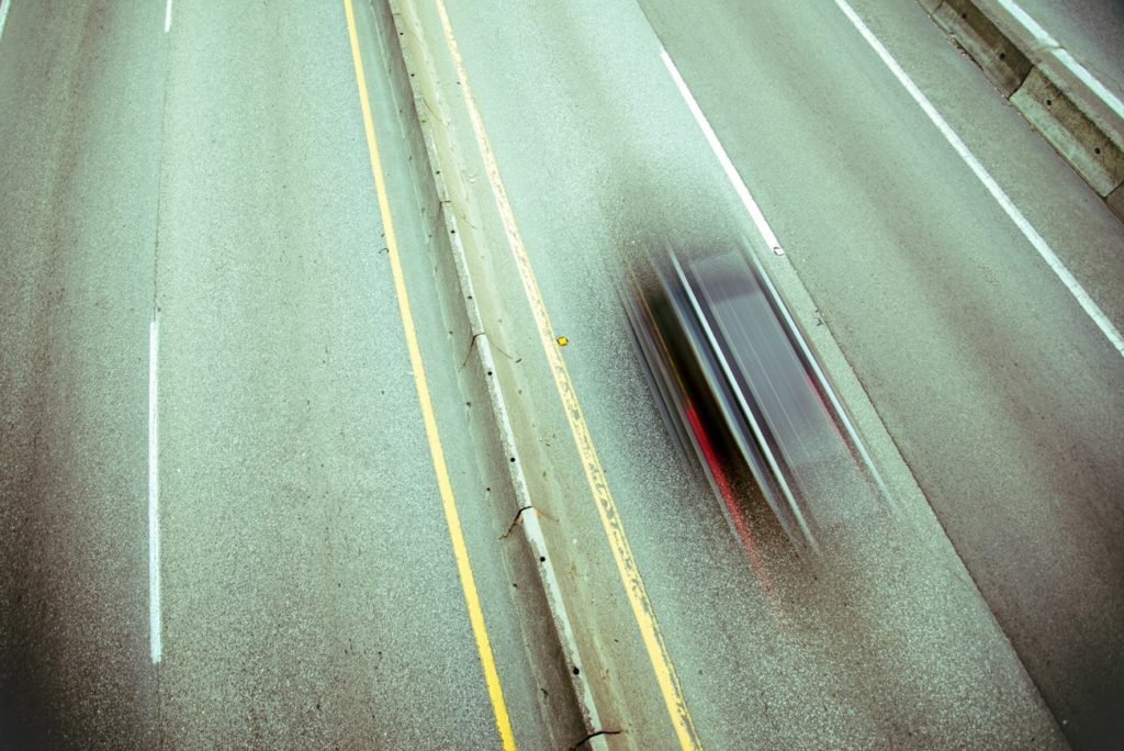 Car Speeding on a Highway, Long Exposure