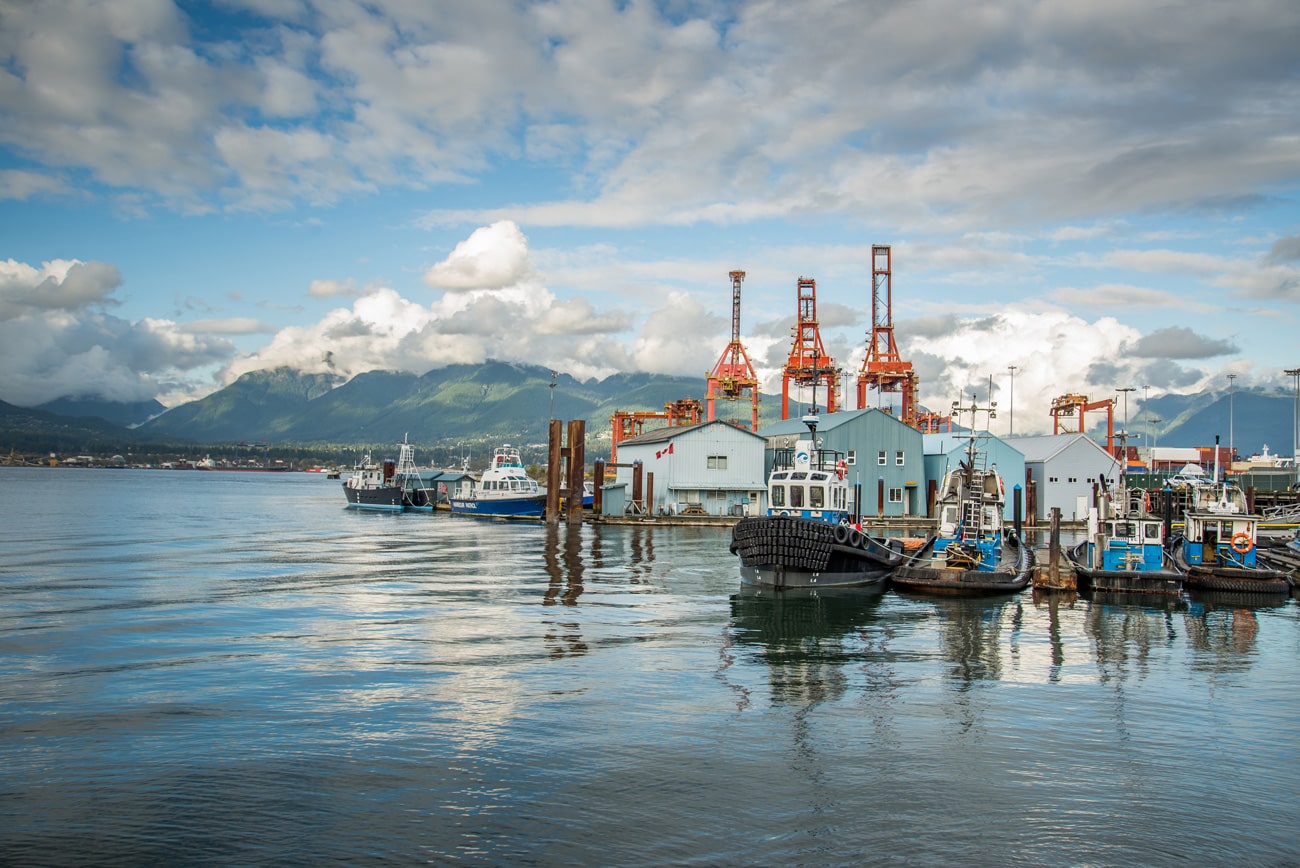 A beautiful landscape from Crab Park in Vancouver, Canada. View of ocean, North Vancouver mountains and boats.