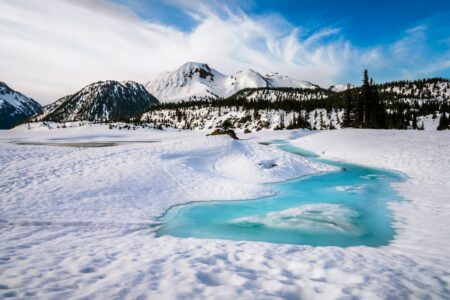 Snow, mountains and white clouds, landscape in Garibaldi Lake, British Columbia, Canad