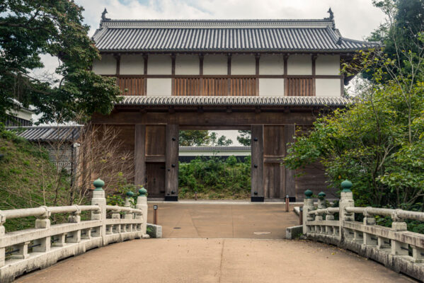 Front view of Mito Castle Otemon Gate in Mito, Ibaraki - large wooden castle gate rebuilt in 2020, approached via a stone Ote-Bashi bridge.